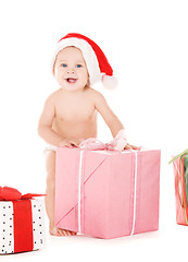 Image showing santa helper baby with christmas gifts