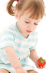 Image showing little girl with strawberry