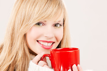 Image showing happy teenage girl with red mug