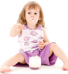 Image showing little girl with yogurt