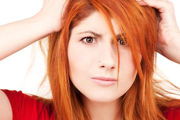 Image showing unhappy redhead woman