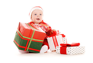 Image showing santa helper baby with christmas gifts