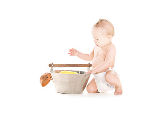 Image showing baby boy with wash-tub and scoop