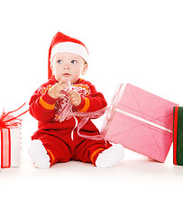 Image showing santa helper baby with christmas gifts