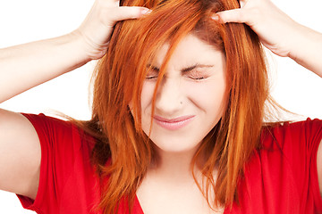 Image showing unhappy redhead woman