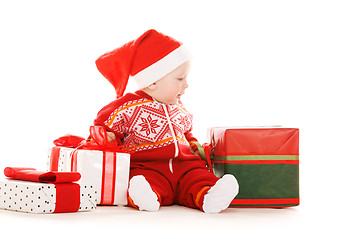 Image showing santa helper baby with christmas gifts