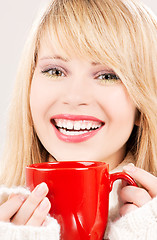 Image showing happy teenage girl with red mug