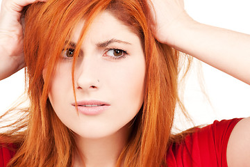 Image showing unhappy redhead woman