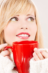 Image showing happy teenage girl with red mug