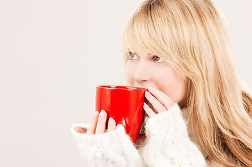 Image showing happy teenage girl with red mug