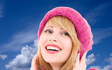 Image showing teenage girl in hat over winter sky