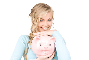 Image showing lovely woman with piggy bank