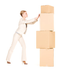 Image showing businesswoman with boxes