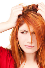 Image showing unhappy redhead woman