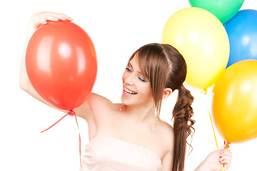 Image showing happy teenage girl with balloons