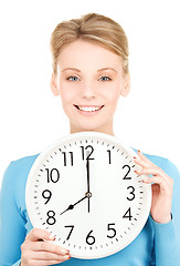 Image showing woman holding big clock