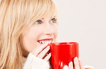 Image showing happy teenage girl with red mug