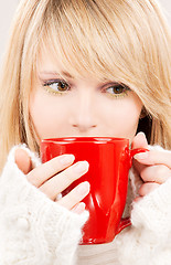 Image showing teenage girl with red mug