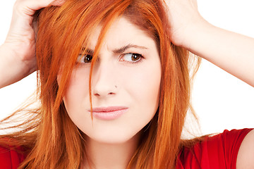 Image showing unhappy redhead woman