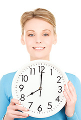 Image showing woman holding big clock