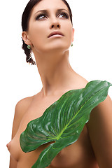 Image showing woman with green leaf