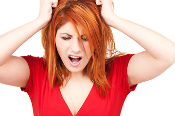 Image showing unhappy redhead woman