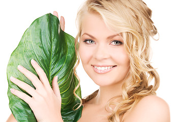 Image showing woman with green leaf