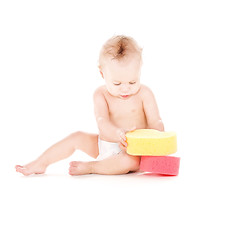 Image showing baby boy with sponges