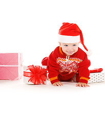 Image showing santa helper baby with christmas gifts