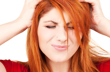 Image showing unhappy redhead woman