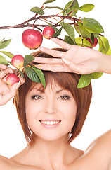 Image showing happy woman with apple twig