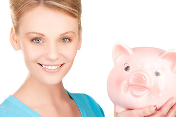 Image showing lovely woman with piggy bank