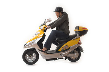 Image showing woman riding scooter