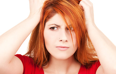 Image showing unhappy redhead woman