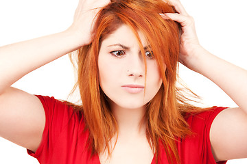 Image showing unhappy redhead woman