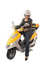 Image showing woman riding scooter