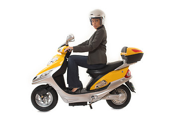 Image showing woman riding scooter