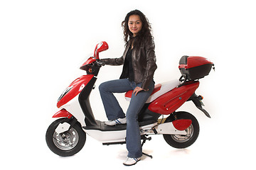 Image showing woman riding electric scooter with no helmet