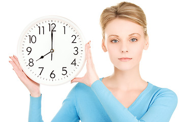 Image showing woman holding big clock