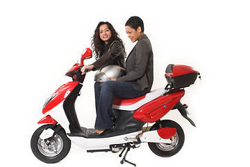 Image showing couple girls talking on  scooter