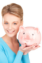 Image showing lovely woman with piggy bank