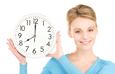 Image showing woman holding big clock