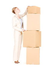 Image showing businesswoman with boxes