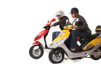 Image showing couple girls racing on electric scooter