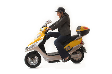 Image showing woman riding scooter