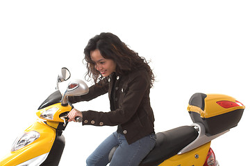 Image showing woman riding electric scooter with no helmet