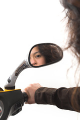 Image showing girl looking in a mirror