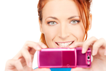 Image showing happy woman using phone camera