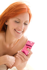 Image showing happy redhead woman with cell phone