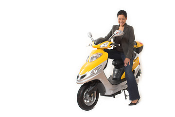 Image showing woman riding electric scooter with no helmet